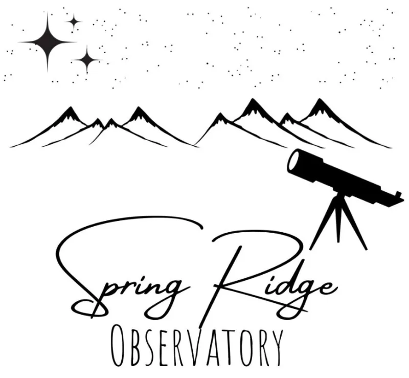 a telescope and mountains with stars
